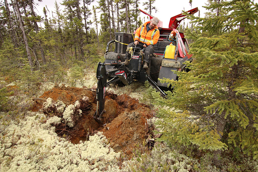 track-mounted machine taking soil samples at the Chevrier project in Quebec