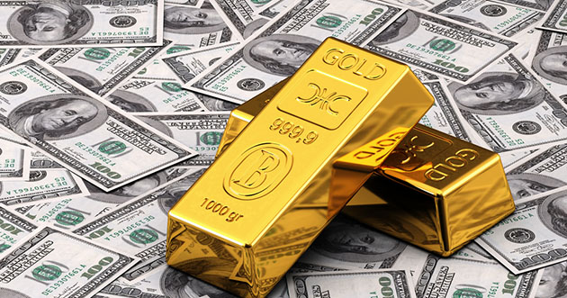 gold bars on dollars