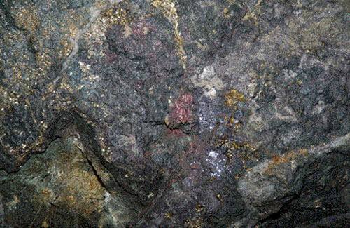 Quartz, semi-massive and massive sulfide material with good grades of gold, silver, copper, lead, an