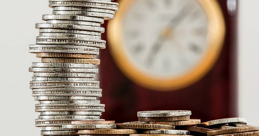 silver coin stack with clock