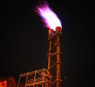 Oil spout with purple flames