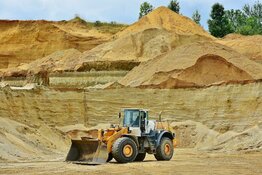 Excavator on yellow ground