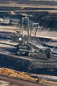 Mining machinery over a rocky landscape