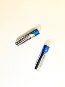 Two batteries on a yellow background Two batteries on a yellow background